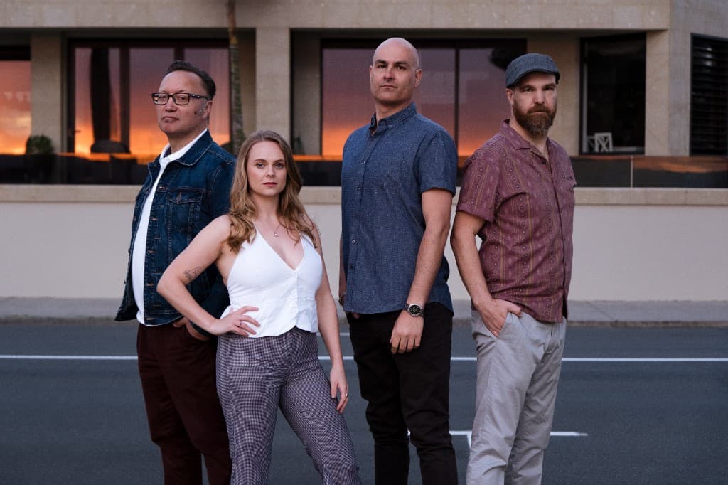 Midnight Fizz — golden hour in front of glass building